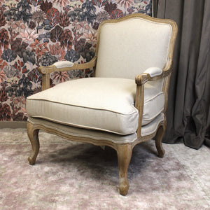 Stunning Ridley Chateaux Accent Chair with a Bergère-inspired design, featuring plush cushions and a carved wooden frame