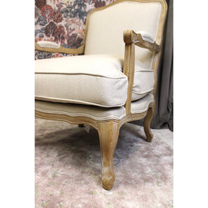 Ridley Chateaux Accent Chair in a begere style with a carved wooden from and beige seat